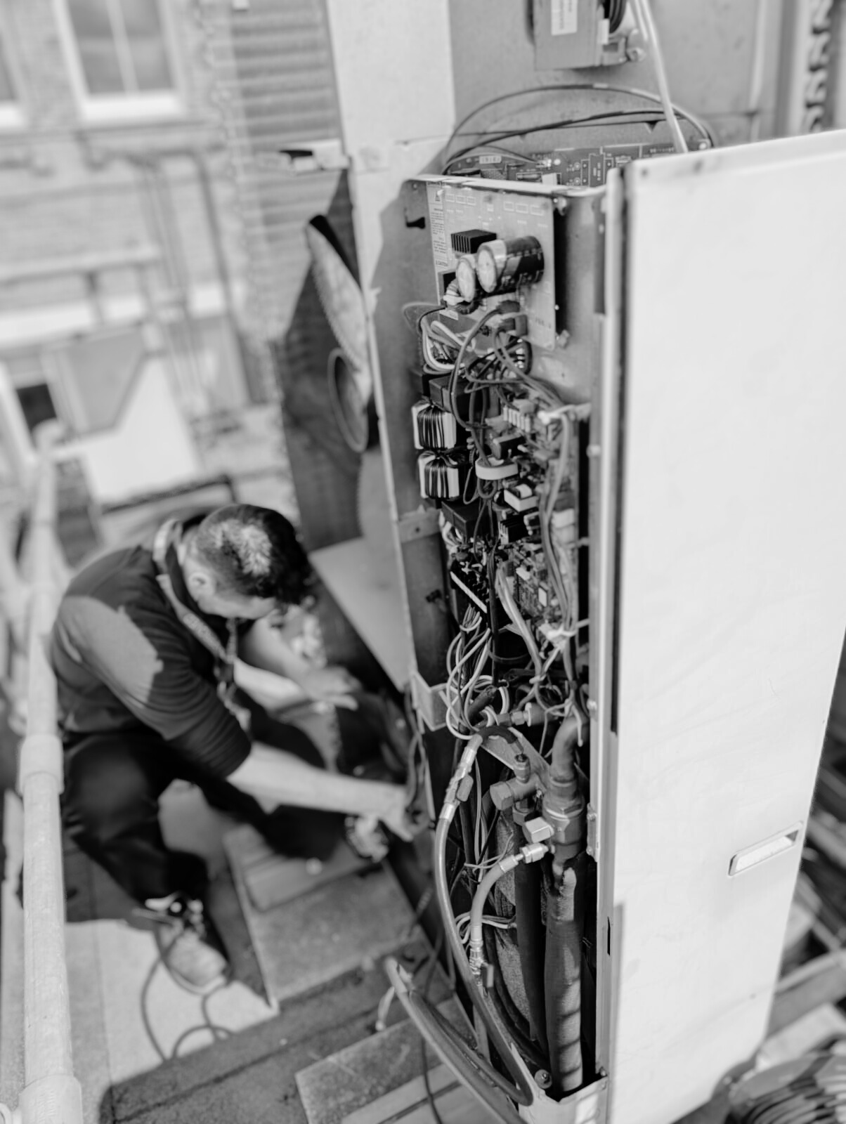 Aster Building Services engineer changing a coil on an ACU